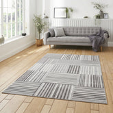 Apollo 2681 Modern Linear Rug in Green/Ivory styled in a modern bedroom