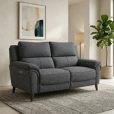 Modern three-seater recliner sofa with coil sprung foam seating.