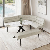 A modern curved upholstered banquette seating set with a matching bench, arranged around a round white marble-top table in a bright dining or lounge area with a window, pool view, and light rug.