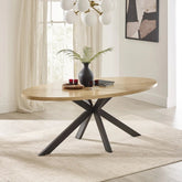 Shop the Bondi 200cm Oval Dining Table featuring a light oak veneer top, curved surfboard design and striking black metal spider base. Modern dining style.