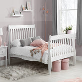 Solid pine wood bed frame with natural finish and minimalist design.