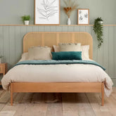 Natural modern bed with rattan and oak design.