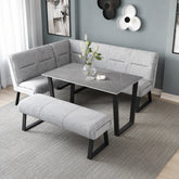 Modern dining area featuring Cerutti grey fabric corner dining bench, backless bench and grey ceramic dining table
