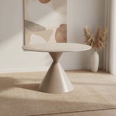 Round dining table with a textured surface and cone-shaped base on a white background