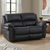 Black leather reclining 2 Seater sofa in a modern living room setting with wood floors, a sideboard, and a window in the background.