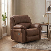 A brown leather recliner chair in a styled living room setting with a side table, lamp, window, and patterned rug.