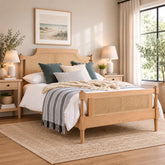 Luxury king size bed with natural oak grain and rattan detailing.