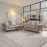 Luxury Highgate Dion sofa with feather-filled cushions, soft fabric upholstery, and elegant styling.