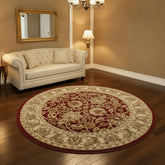 Vintage inspired round rug with bold red pattern.
