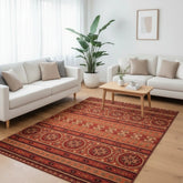 Terracotta rug with traditional tribal design.