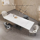 Modern Phoenix High Gloss White Ceramic on Glass Double Extending Dining Table with artistically designed designer base Sold online by Pendle Village Furniture Styled in a living room with chairs