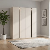 Beige wardrobe in a room with a plant and rug