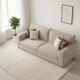 Modern small sofa with taupe accent cushions UK.