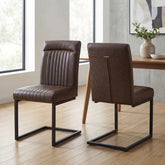 Shop Ludlow Brown leather effect cantilever dining chairs with ribbed stitching, padded high backs and black metal frames. Sets of 4, 6 or 8.