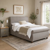 Elegant king bed with classic sleigh silhouette and sprung slatted base.