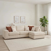 Comfortable chaise lounge with cord fabric, wooden feet, and scatter cushions.