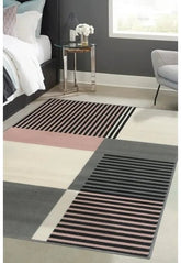 Blush rug with modern barcode inspired striped design.