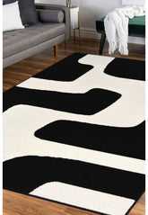 Black rug with bold geometric block pattern design.