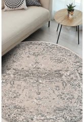 Round cream rug with traditional pattern and durable polypropylene fabric.