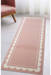 Blush runner rug with elegant scallop pattern design.