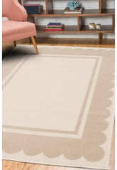 Natural rug with elegant scallop border design.