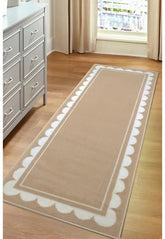 Natural runner rug with subtle scallop pattern design.