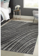 Charcoal rug with modern swirl pattern design.