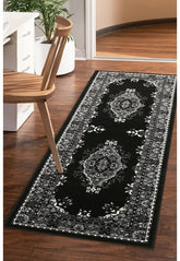 Black and grey runner rug with geometric pattern design.