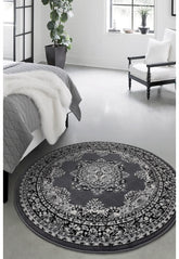 Round grey rug with timeless traditional design.