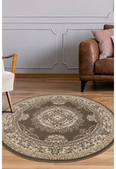Round taupe rug with timeless traditional design.