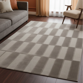 Grey rug with modern block pattern and textured design.