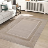 Natural rug with modern tone on tone border design.