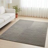 Grey rug with modern knot pattern and textured design.