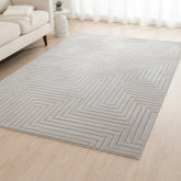 Grey rug with modern maze pattern and geometric design.