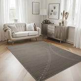 Grey rug with modern wave pattern and flowing design.