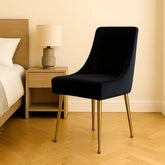Lifestyle image of Mason Black Velvet Dining Chair with Gold Legs and Handle