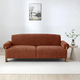 Miles Orange Chenille 3 Seater Sofabed upholstered in rust-orange textured fabric with light wood legs, shown in a minimalist living room.