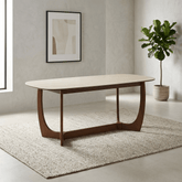 Discover the Portofino 180cm dining table with a luxurious natural stone top, sculptural walnut-effect base and rounded edges. Seats 4–6 people.