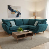 Modern chaise lounge sofa with wooden legs and soft cushions.