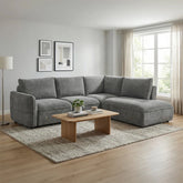 Polly dark grey fabric corner sofa bed with storage chaise, pull-out bed mechanism and left or right hand facing options. Ideal for modern homes.
