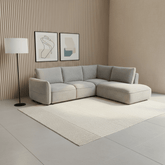 Polly silver fabric corner sofa bed with hidden storage, lift-and-pull bed mechanism and left or right-hand chaise options. Stylish and practical.