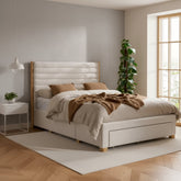 Grey velvet bed with tufted headboard and built in storage drawers.