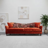 Tiffany Spink velvet grand sofa with elegant curved design.