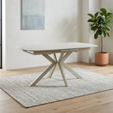 Shop the Tino Travertine ceramic extending dining table with a cream metal spider base. Heat and scratch resistant ceramic top extends from 160cm to 200cm.
