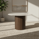 Vigo 120cm round dining table with a white stone-effect top and walnut fluted pedestal base. Contemporary dining table seating up to 4 people.