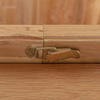Close-up of a brass Dining table extension latch securing a wooden extension of Chatsworth Oak Extending Dining Table 120-153cm