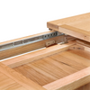 Close-up of a Chatsworth Oak Extending Dining Table with a lift-top section raised, showing metal drawer or cabinet pull hardware and the interior wood structure against a white background.