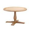 A round wooden dining table with a pedestal base and four legs, shown on a plain white background.