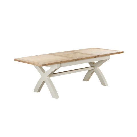A Foxington dining table with a light natural wood top and a white painted X-frame base, shown on a plain white background.