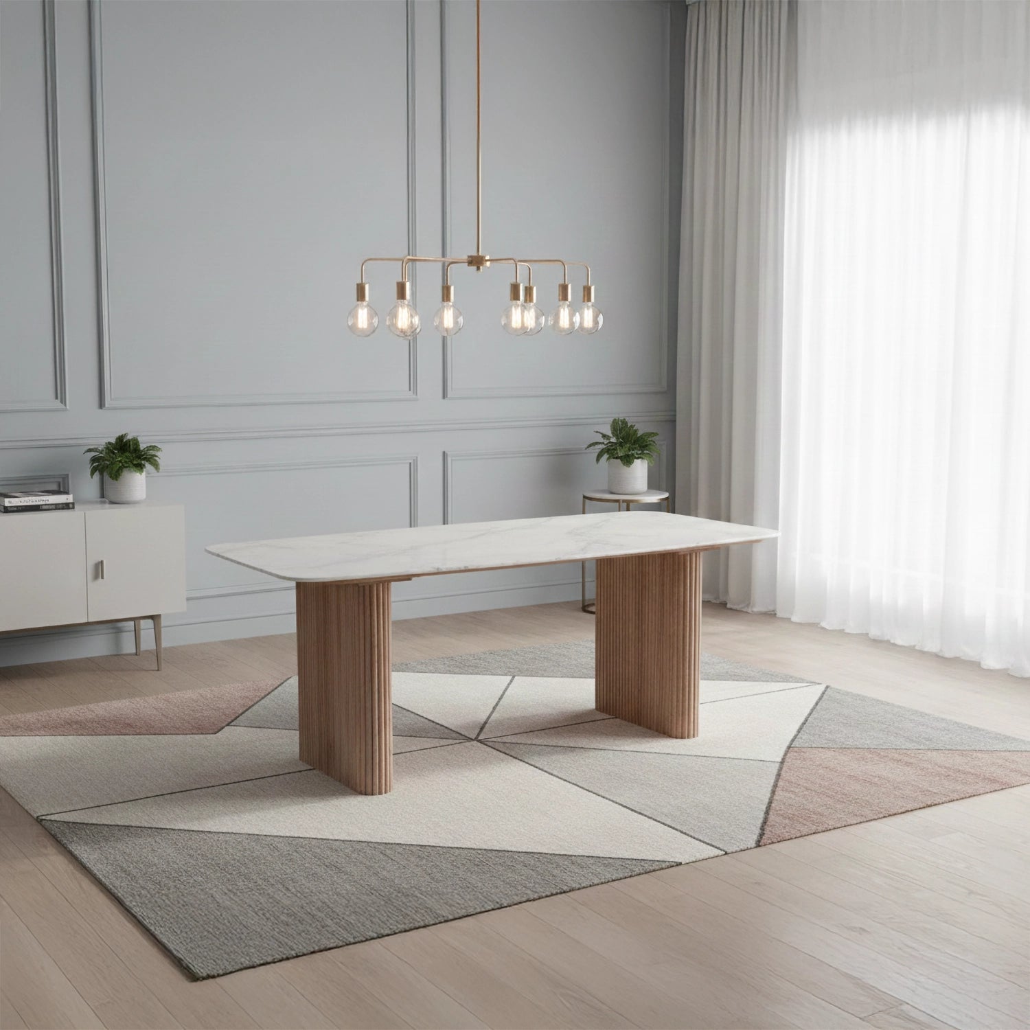 Styled in a room Aimar marble dining table with solid marble top and reeded mango wood legs. 